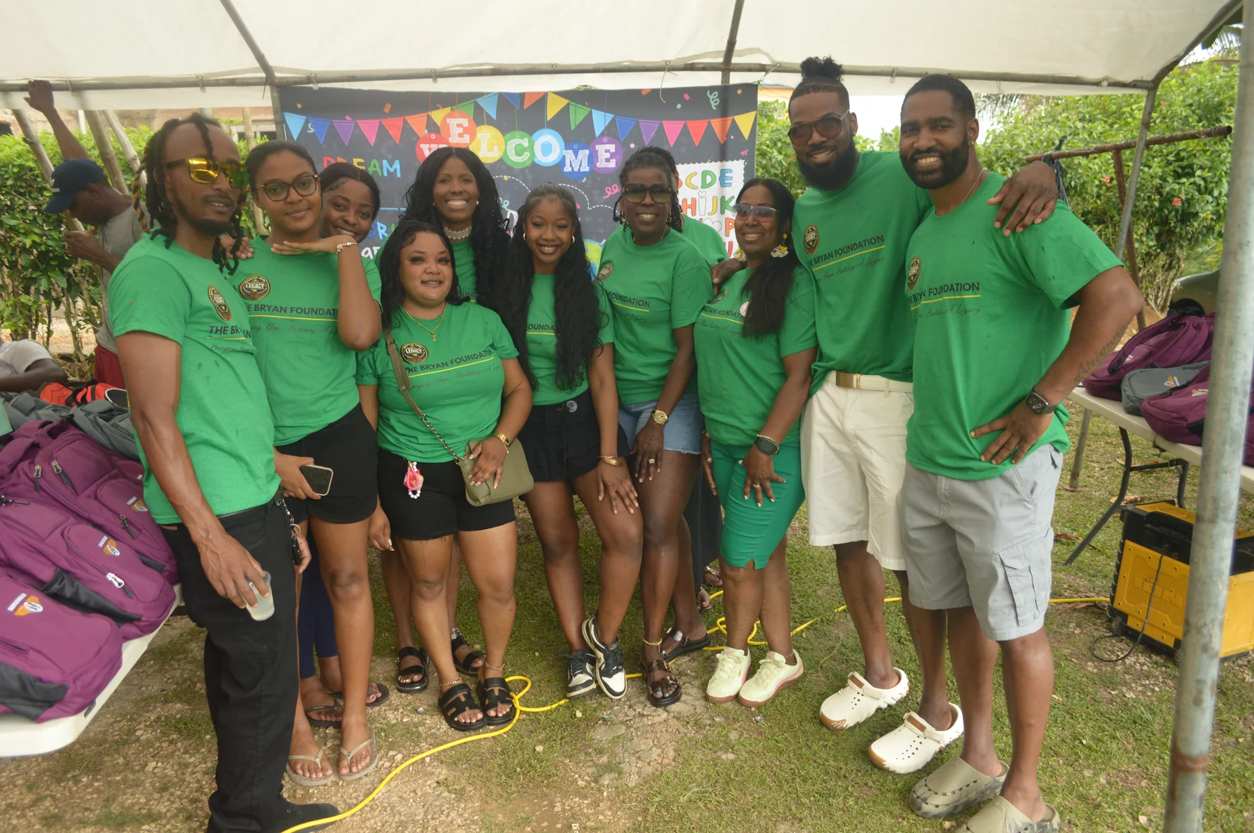 Bryan Foundation family and volunteers in green shirts